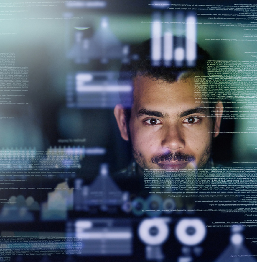 A man looks at multiple data charts and code displayed on transparent screens, suggesting data analysis or software development.