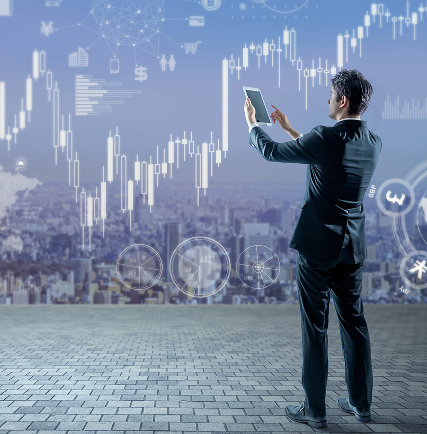 A man in a suit uses a tablet while standing outdoors, with virtual financial charts and digital icons overlaying a cityscape background.
