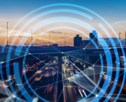A busy city highway at dusk with blurred car lights, overlaid with concentric digital circles and connecting lines, suggesting technology and connectivity.